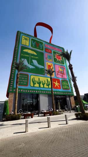 Coffee Cans Fall from Café Rooftop in a fake-out-of-home ad of Koffee Kulture