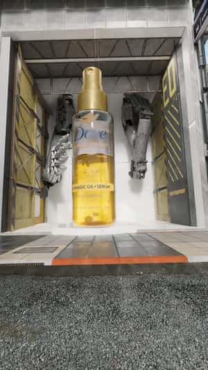 Hair Serum Appears at Mechanic Shop in a fake-out-of-home ad of Dove