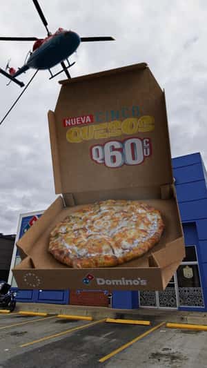 Helicopter Delivers Pizza Box in a fake-out-of-ad of Domino's