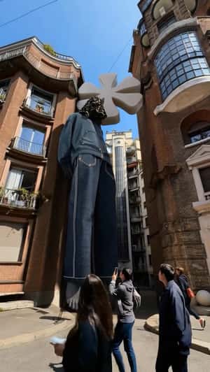 Towering Denim Figure in Milan in a fake-out-of-home ad of House of Pezzo