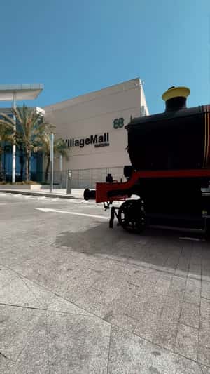 Christmas Train Arrival in a fake-out-of-home ad of Village Mall