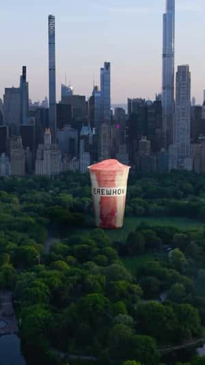 Monumental Smoothie Cups Across U.S. in a fake-out-of-home ad of Erewhon