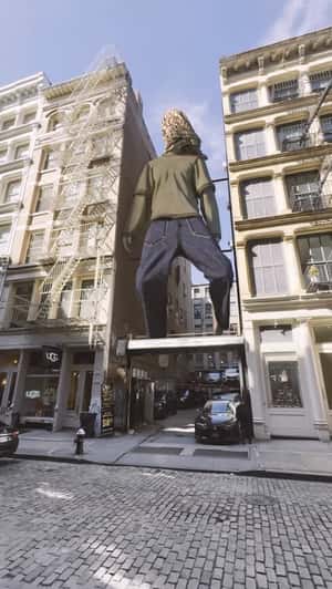 Giant Figure on Platform in a fake-out-of-home ad of House of Pezzo