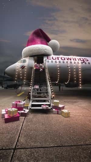 Airplane Overflowing with Gifts in a fake-out-of-home ad of Eurowings