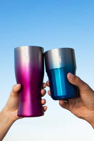 Giant Insulated Tumbler Cools Hot Beach in a fake-out-of-home Stanley