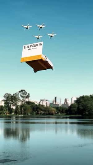 Bed Carried by Drones in a fake-out-of-home ad of The Westin São Paulo