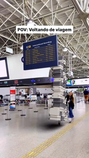 Towering Stack of Luggage at Airport in a fake-out-of-home ad of Bagaggio