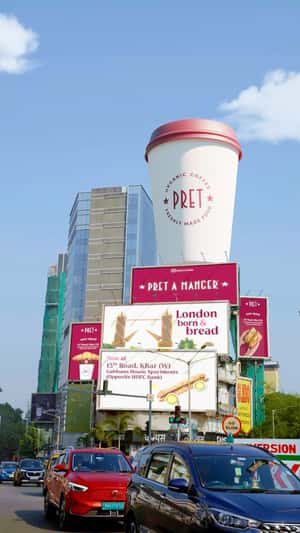 Giant Coffee Cup 0n Top of Building in a fake-out-of-home ad of Pret A Manger