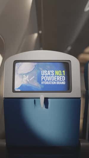 Hydration Packets Outside Plane Window in a fake-out-of-home ad of Liquid I.V.