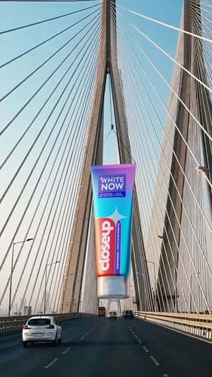 Giant Toothpaste Sways Over Bridge in a fake-out-of-home ad of CloseUp