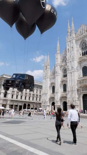 Balloons Lift Mercedes at Duomo di Milano in a fake-out-of-home ad of Merbag