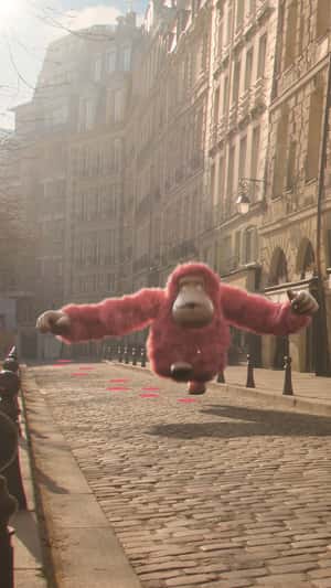 Pink Monkey Leaves Pink Footprints in a fake-out-of-home ad of Kipling
