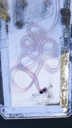 Drift Art in Snow in a fake-out-of-home ad of Porsche