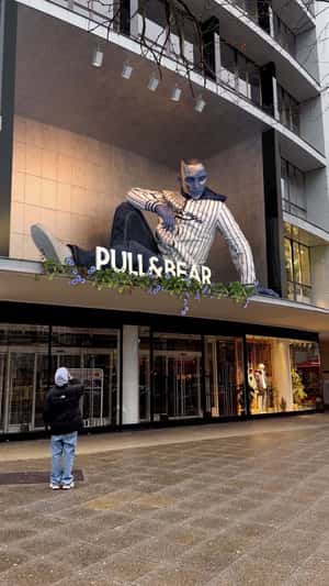 Giant Blue Model in fake-out-of-home ad of Pull&Bear