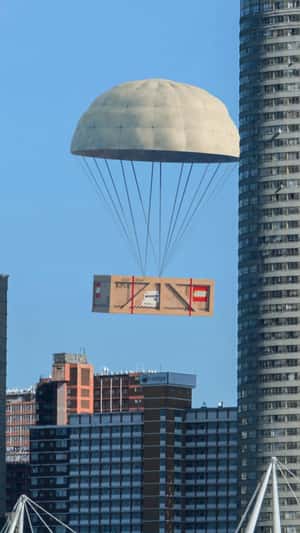 Giant Crate Descends Beside Ponte City in a fake-out-of-home ad by LEGO