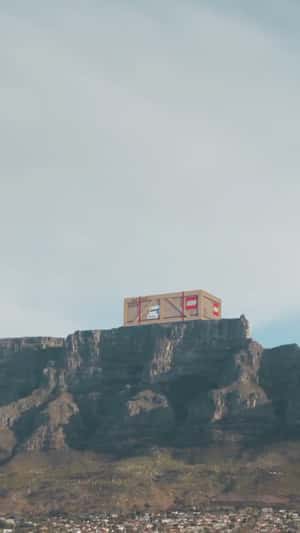 Massive Crate On Table Mountain in a fake-out-of-home ad of LEGO