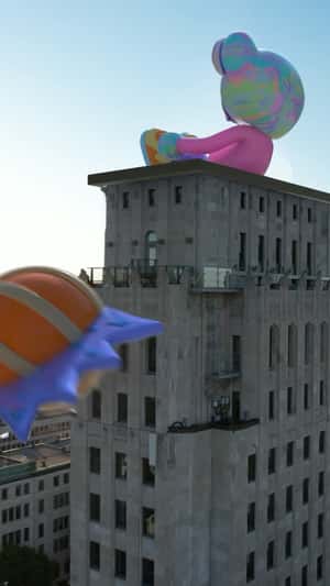 Colorful Inflatable Character in fake-out-of-home ad of Pull&Bear