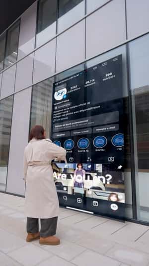 Giant Instagram Screen on Glass Facade in a fake-out-of-home ad of Hyundai