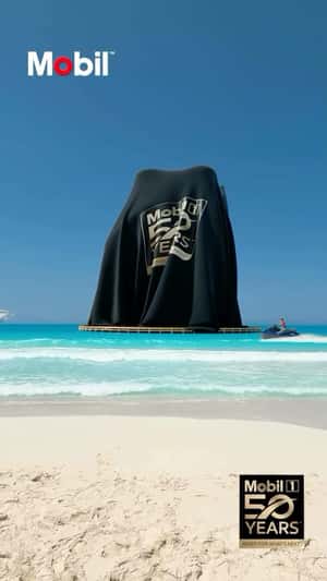 Giant Bottle on Beach in a fake-out-of-home ad of Mobi