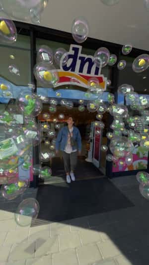 Floating Bubbles in Storefront in a fake-out-of-home ad of DM