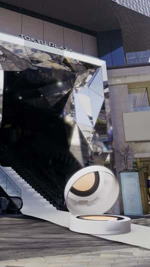 Giant Compact Rolls Into Tokyu Plaza in a fake-out-of-home ad of NARS Cosmetics