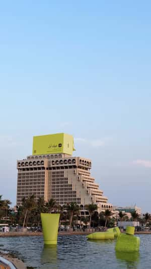 Giant Box On Government Hotel in a fake-out-of-home ad of Gold Apple 