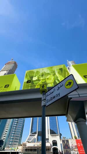 Giant Boxes on Elevated Track in a fake-out-of-home ad of Gold Apple