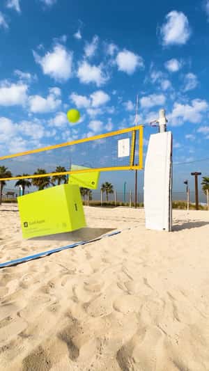 Giant Boxes Play Beach Volleyball in a fake-out-of-home ad of Gold Apple 