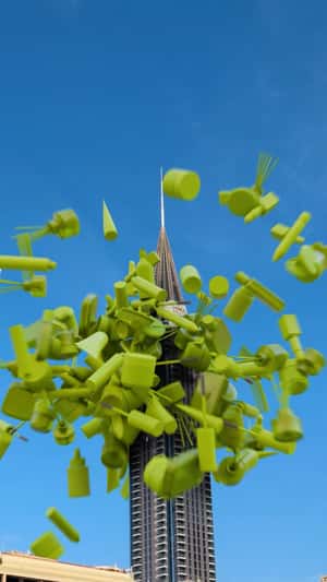 Giant Box Burst in A-Tower in a fake-out-of-home ad of Gold Apple