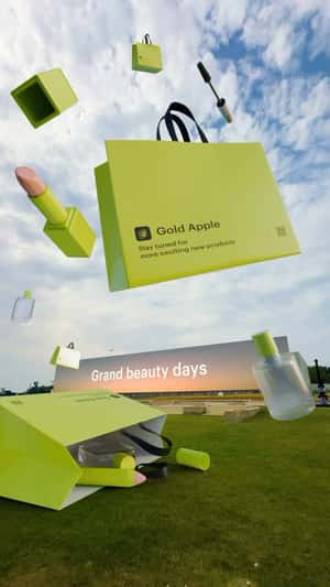 Giant Products in Grassy Field in a fake-out-of-home ad of Gold Apple