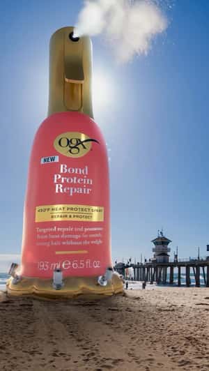 Giant Inflatable Installation at Beach in a fake-out-of-home ad of OGX Beauty