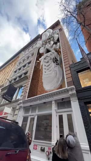 Sneaker Floats with Balloons in fake-out-of-home ad of Stuart Weitzman