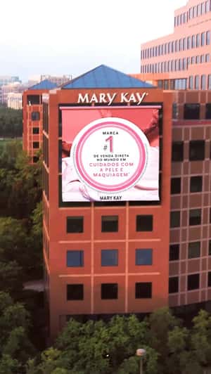 Giant Banner Unfolds at HQ in a fake-out-of-home ad of Mary Kay