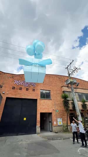 Giant Boxes Delivered by Balloons in a fake-out-of-home ad of Milagros