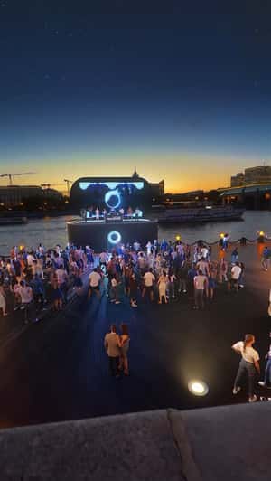 Giant Speaker Stage Installation on Waterfront in a fake-out-of-home ad of Technopark
