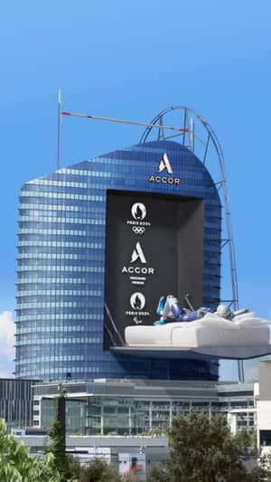 Robot Vaults into Bed in a Building in fake-out-of-home ad of Accor