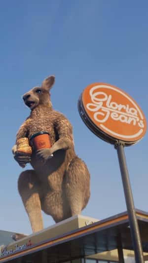 Giant Kangaroo Atop Store in a fake-out-of-home ad of Gloria Jean’s Coffee 