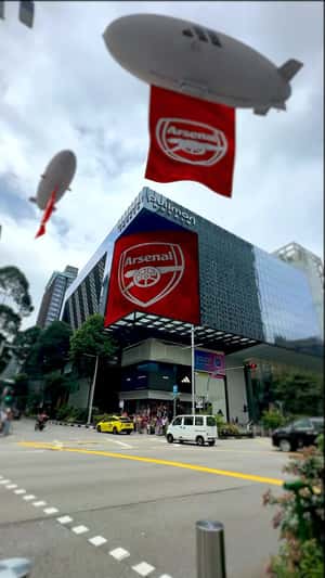 Blimps with Arsenal Banners at Orchard Road in a fake-out-of-home ad of Adidas