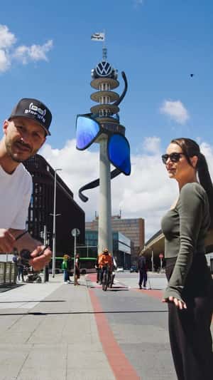 Giant Sunglasses Spiral on Telemax Tower in a fake-out-of-home ad of Gloryfy