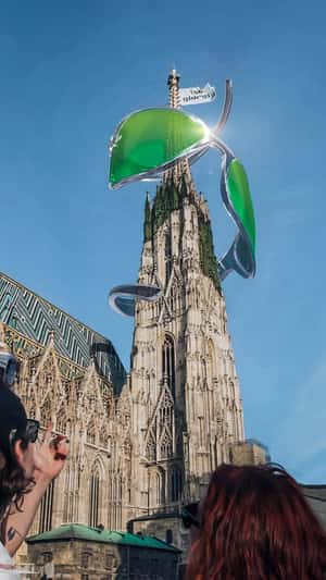 Giant Sunglasses Spiral on Vienna Cathedral in a fake-out-of-home ad of Gloryfy