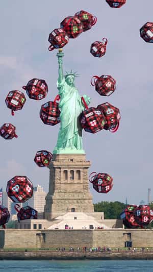 Giant Christmas Balls Fall at Statue of Liberty in a fake-out-of-home ad of Happy Socks 