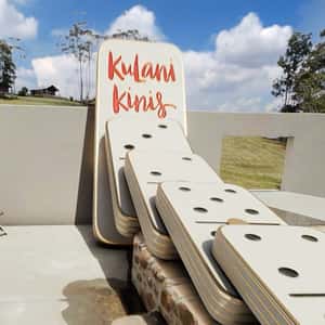 Progressive Dominoes at Poolside in a fake-out-of-home ad of Kulani Kinis 