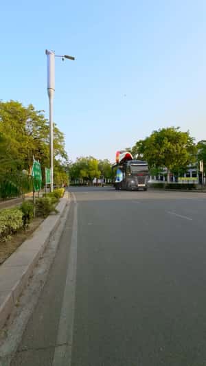 Giant Sneakers on Flatbed Truck in a fake-out-of-home ad of Liberty Shoes 