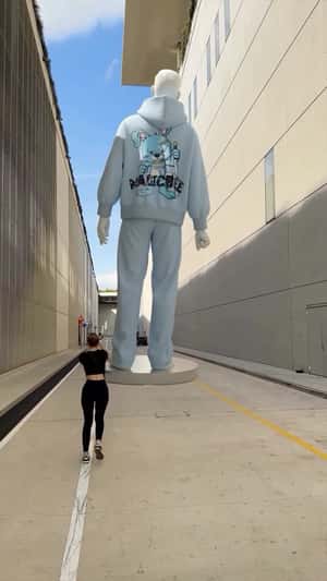 Giant Mannequin Spins Into New Outfits in a fake-out-of-home ad of Magicbee