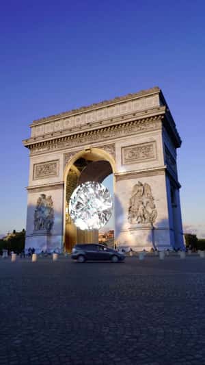 Giant Floating Crystal at Arc de Triomphe in a fake-out-of-home ad of Messika