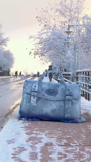 Giant Bag Melts on Sidewalk in a fake-out-of-home ad of Mulberry
