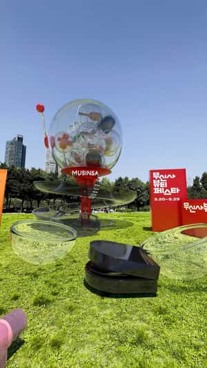 Giant Beauty Items and Toy Capsule in a fake-out-of-home ad of Musinsa