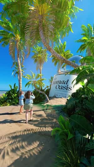 Giant Bottle And Oasis Emerge From Sand In A fake-out-of-home Ad Of Primark