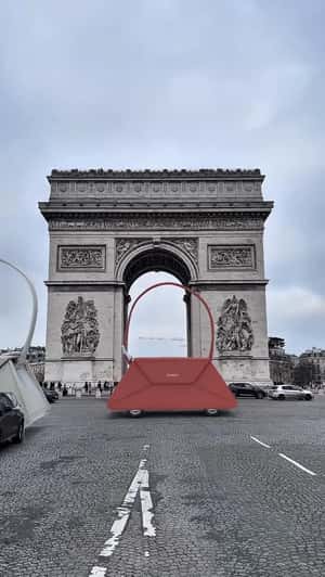 Giant Handbags Roll Past Arc de Triomphe in a fake-out-of-home ad of Zivera 