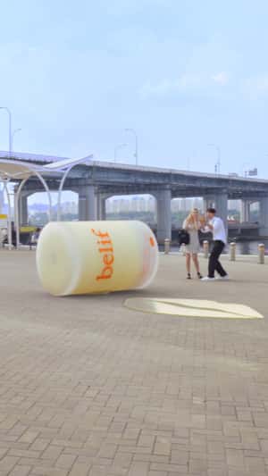 Giant Lipcerin Rolls on Pavement in a fake-out-of-home ad of Marie Claire